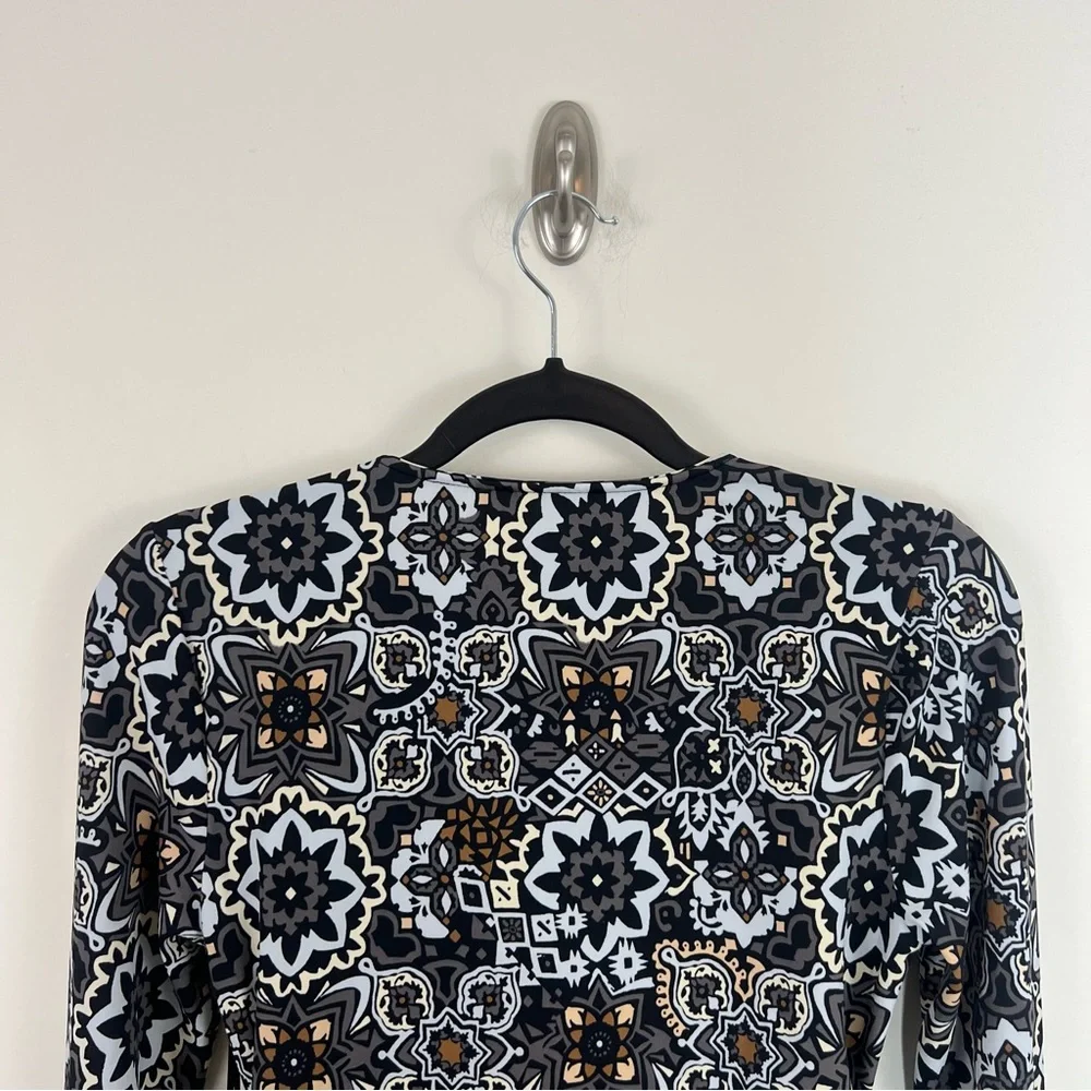 Ambernoon II by Dr. Erum Ilyas Floral Print 1/4 Zip Roll Tab Sleeve Rash Guard